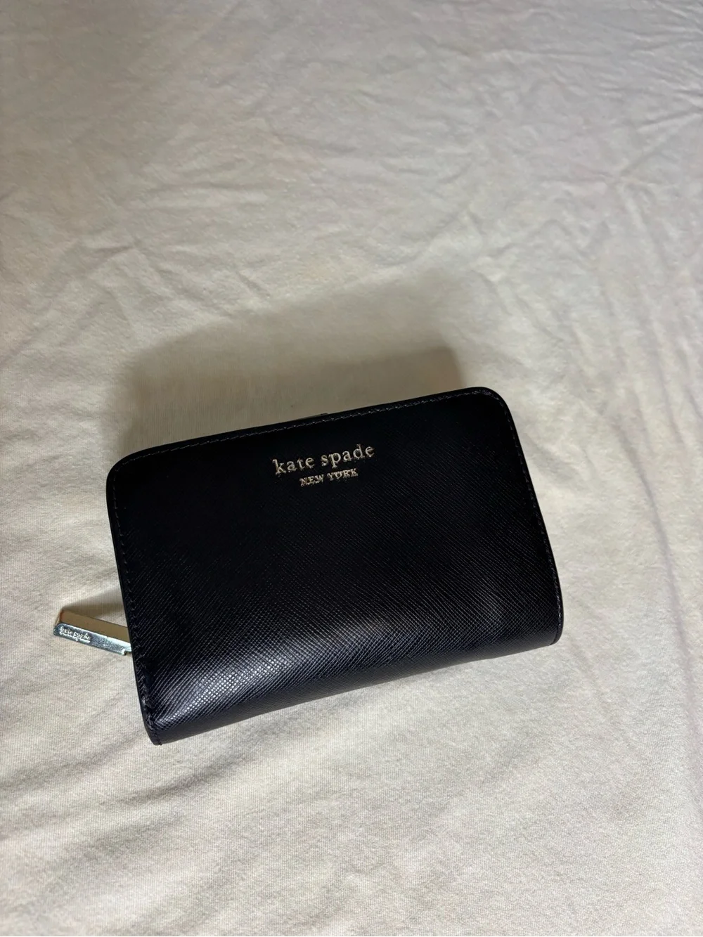 kate spade black zip-around leather wallet with gold logo
